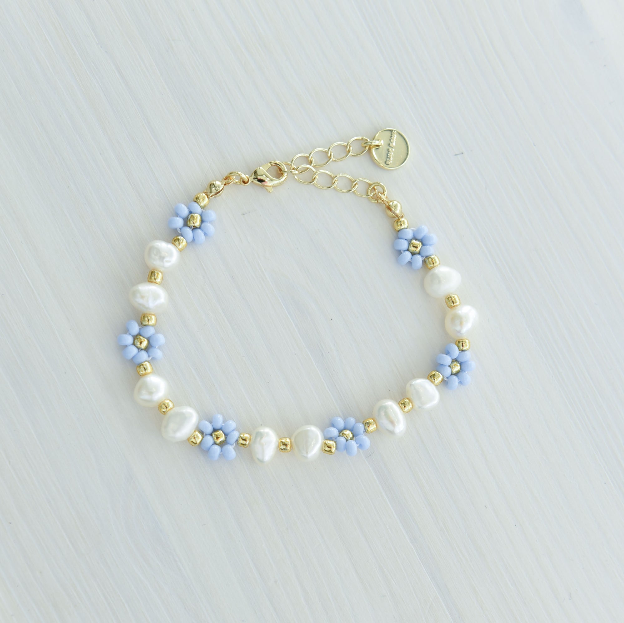 Linn  blomsterarmbånd lyseblå